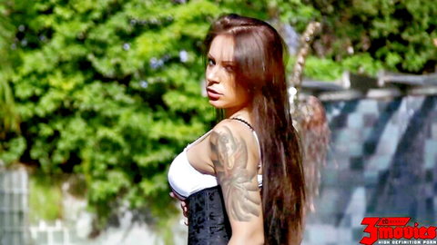 Tori Black teases with big tits in white bra and black corset outdoors
