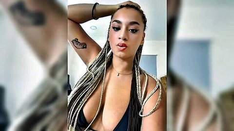 Thick mixed babe with massive tits bursting from tiny black slingshot bikini top