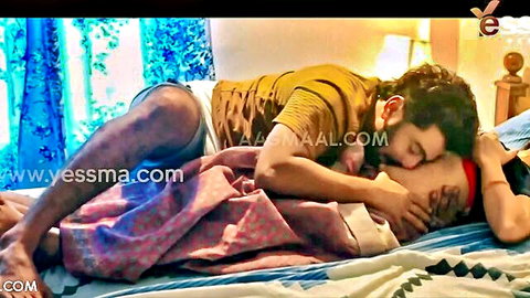 Indian nurse embraced intimately by man in bed at night