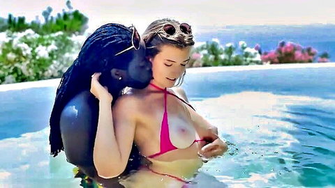 Blonde in pink micro bikini kissed by black hunk in steamy hot tub vacation