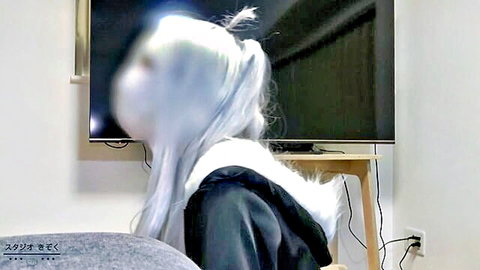 Sexy Black Cat cosplay girl with long white hair sitting on couch from behind
