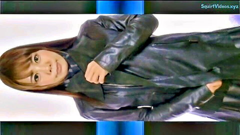 Mature Asian woman in sleek black leather jacket, seductive pose