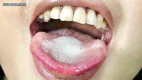 Iori Kogawa's open mouth with semen on tongue in JAV bukkake