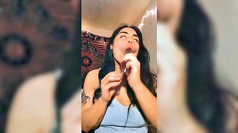 Thickieyaya teasing with chocolate spoon in blue dress, playful mouth open