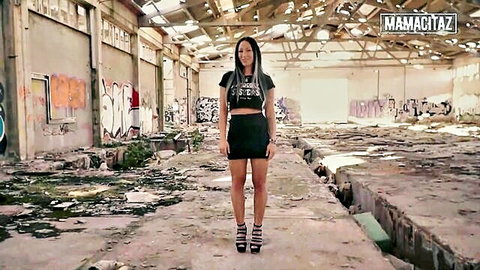 Sexy Latina in slutty crop top and mini skirt posing in abandoned spot