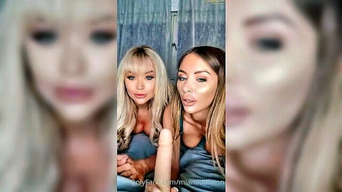 Two busty blondes teasing with deep cleavage in tight gray tank tops hugging seductively