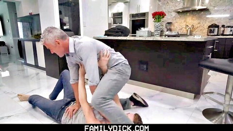 Silver fox DILF pins down young guy on kitchen floor in gay domination foreplay