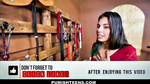 Latina teen in red sparkly dress posing in BDSM dungeon