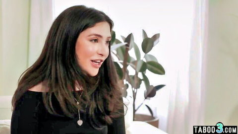 Brunette journalist in off-shoulder top during intimate interview