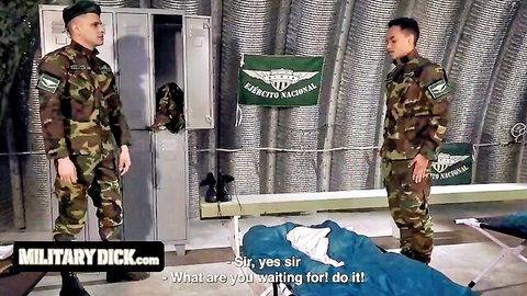 Muscular gay soldiers in camo uniforms stand sir yes sir in steamy military locker room