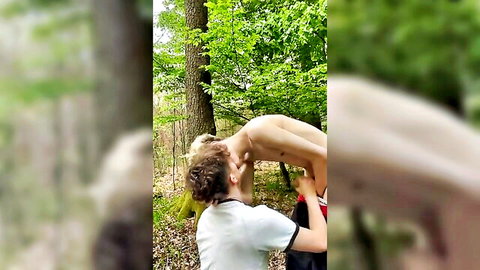 Guy holds blond twink upside down in forest rimming his exposed tight ass