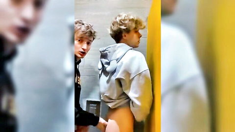 Young blonde guys in hoodies, one exposing bare ass for friend