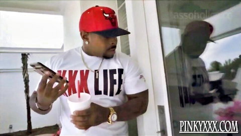 Monroe Sweets ebony BBW in XXX Life tee and Bulls hat, teasing with phone