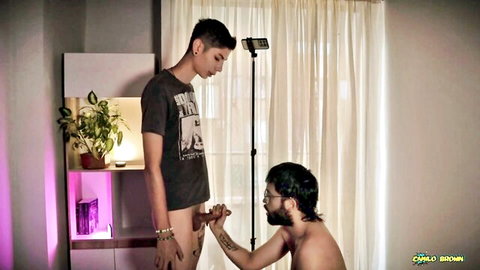 Camilo dark-skinned daddy deepthroats skinny twink's fat cock