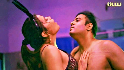 Indian couple in passionate neck kiss, woman in black lace lingerie