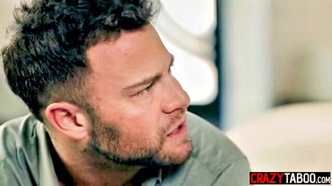 Bearded man with curly hair in green shirt, intense look from bully adult video