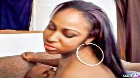 Curvy ebony BBW MILF with long hair and hoop earrings, bare back tease