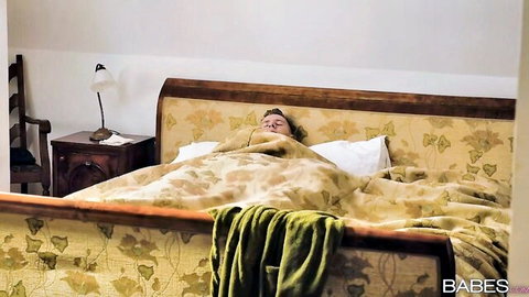 Ebony Jasmine Webb lying asleep in bed, teasing lesbian affair