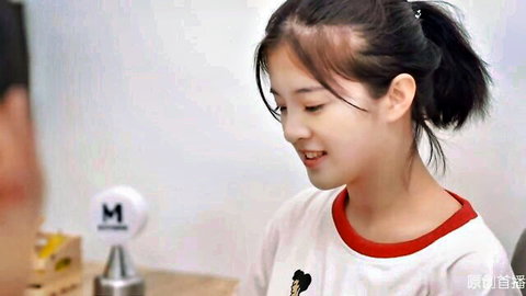 Cute Asian teen girl with ponytail smiling in white shirt with red trim