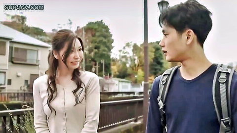 Japanese brunette MILF wife in cardigan smiles flirtatiously at young neighbor guy outdoors
