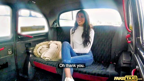 Baby Nicols smiling seductively in FakeTaxi cab, naughty charm awaits