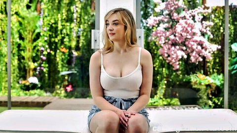 Blonde Summer Matti in low-cut tank top and shorts on casting couch