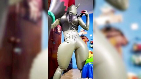 Scarlett in shiny gray latex catsuit, posing with big ass and tail in summer heat tease