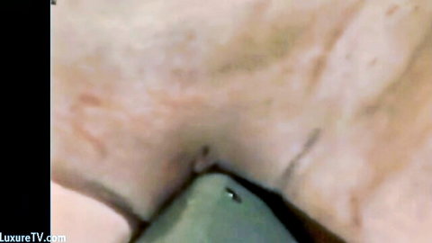 Close-up of sexy MILF's tortured pussy with BDSM clamps and red marks
