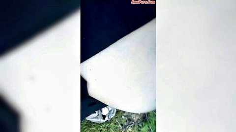 Woman in sudden outdoor desire in city park, provocative pose on grass