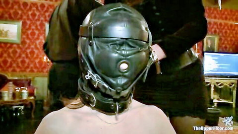 BDSM slaves in leather hood gag and collar, topless blonde sub under dom control