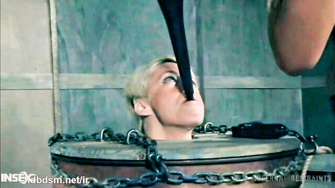 Blonde MILF restrained in barrel during intense lesbian fetish play