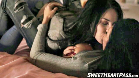 Jade Baker and Reagan Foxx in passionate lesbian embrace, scissoring intimacy