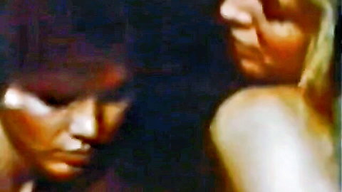 Vintage 1980s porn thumbnail of blonde woman and dark-haired man in intimate close-up