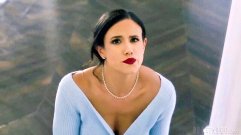 Penny Barber in low-cut blue sweater, pearl necklace, intense gaze, Pure Taboo