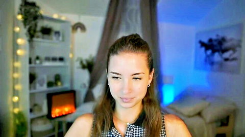 Shy Jane webcam tease in checkered top, smiling seductively