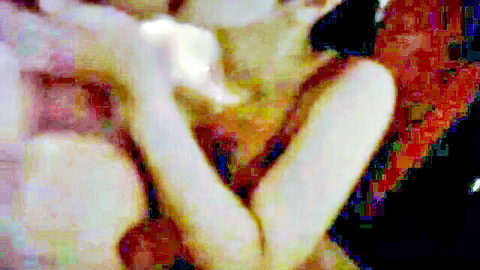 Blurry intimate embrace of Indonesian couple in jilbab and tudung