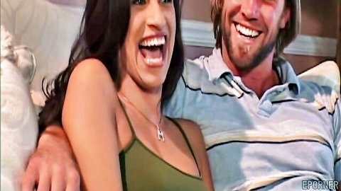 Smiling brunette hotwife leaning on handsome bearded man in casual wear