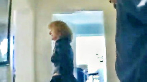 Blonde German granny in dark jacket, amateur home video thumbnail