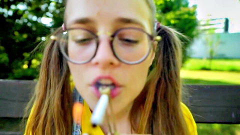 Nerdy model Cowsik in glasses smoking cigarette for first time