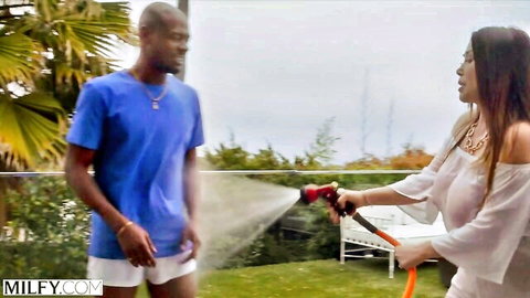 Anna Love teases black stud Anton with hose in wet outdoor play