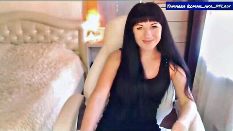 Tamarra Roman teases in chair with small tits and long brunette hair