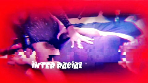 Munro Blaxxx in steamy interracial encounter, hands gripping thighs in neon-lit scene