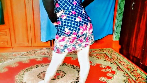 Crossdresser_kitty teasing in floral mini dress and thigh-high white stockings
