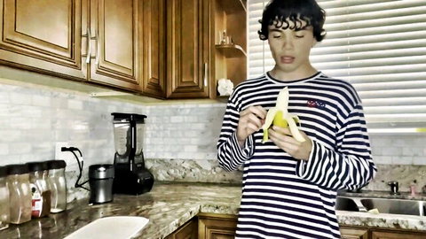 Curly-haired gay teen seductively sucking thick banana like cock in kitchen