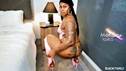 Monroe from BlackTGirls in pink lingerie, squatting big ass pose