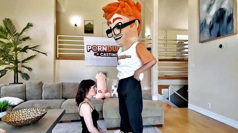 Olive Glass kneels in black dress for Porn Dude casting couch scene