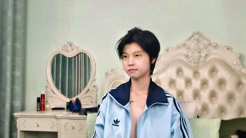 Joycekay Asian teen camgirl in open Adidas jacket, seductive pose