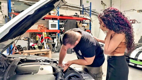 Melissa in sexy crop top and skirt with mechanic in garage