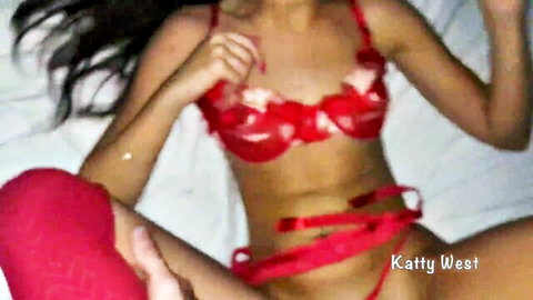 Skinny brunette Katy West spreads legs in red floral lingerie teasing pussy on bed