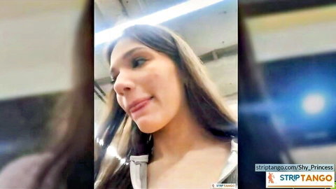 Busty brunette teases deep cleavage tits in open white blouse selfie on train